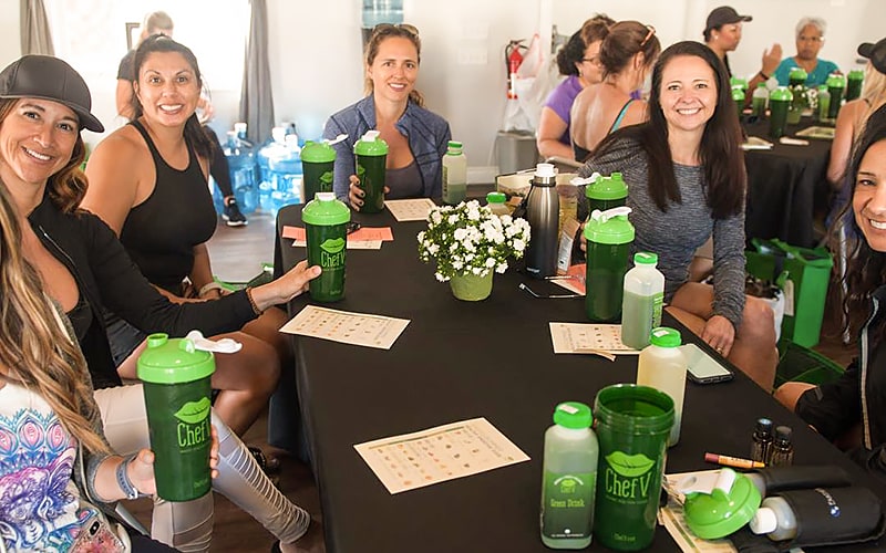 retreat people with green drink at a table
