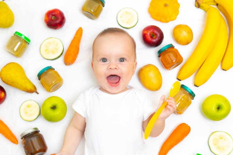 baby with fruits and vegetables